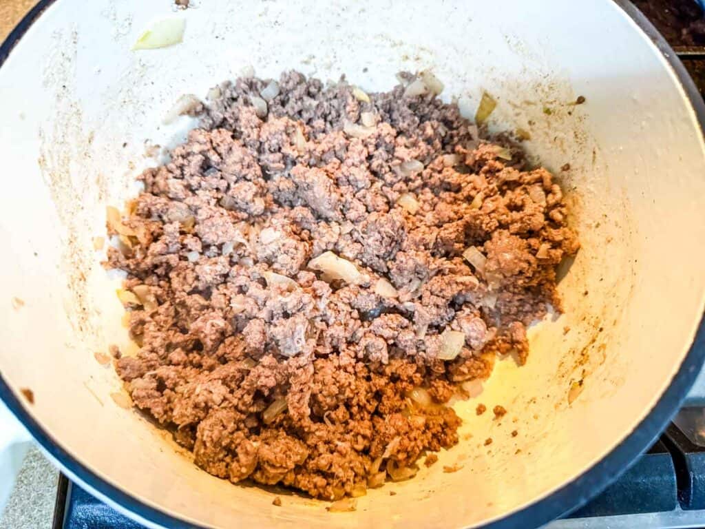 Heat the olive oil then add the ground beef.