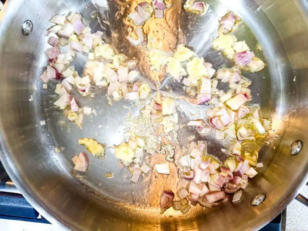 Chopped shallots and minced garlic sautéed in oil.