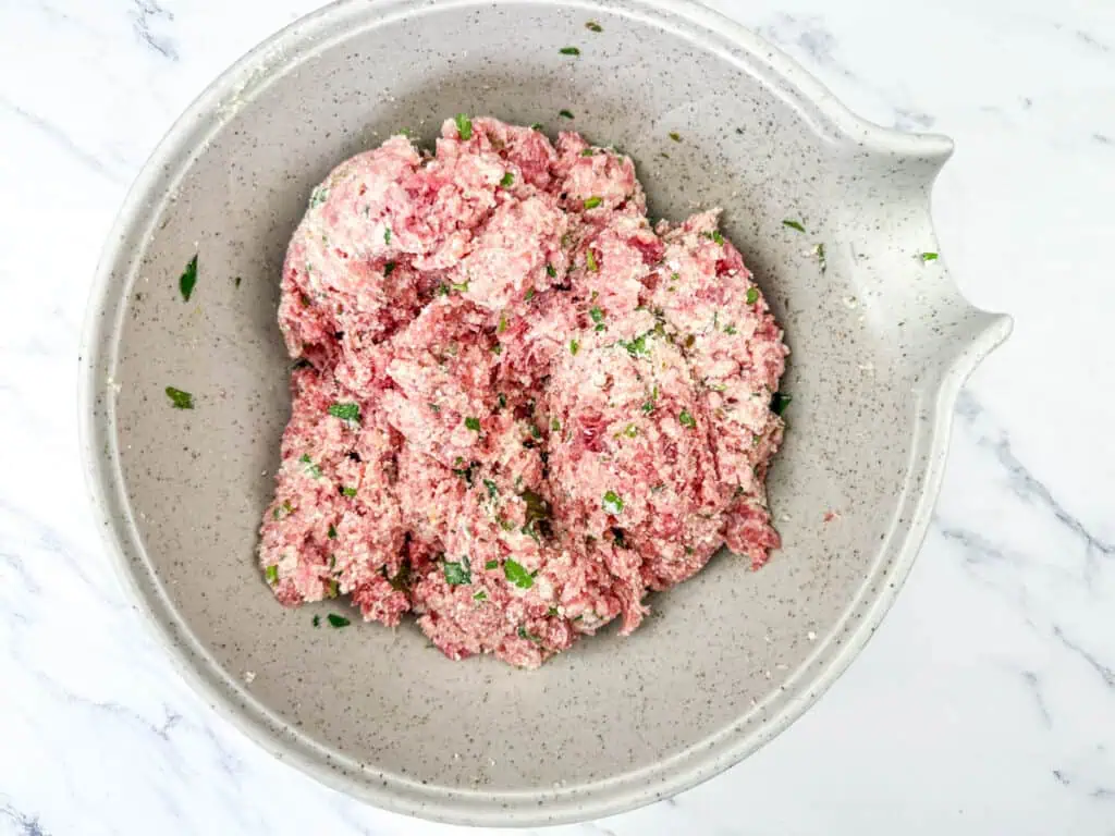 Mixed ricotta with egg, ground beef, ground pork, and ½ teaspoon of salt.