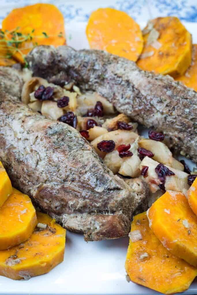 A serving of Slow Cooker Pork Tenderloin with Sweet Potatoes & Apples.