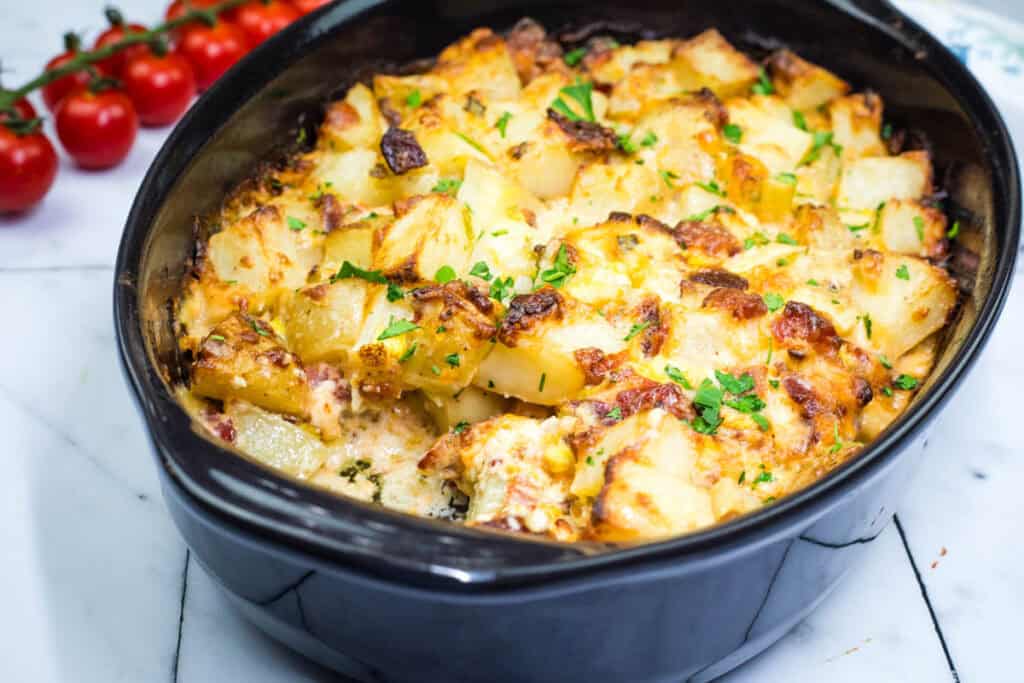 Mississippi Mud Potatoes on a black casserole dish.