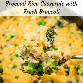 Close-up of a spoonful of broccoli rice casserole topped with melted cheese and fresh broccoli.