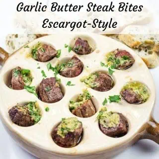 Escargot-style garlic Butter Steak Bites in a round dish.