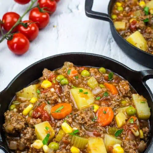 Two cast iron pans filled with a Vintage Hamburger Stew.