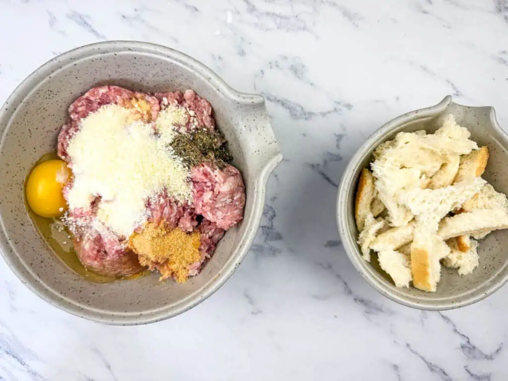 Bread and meatball mixture in two different bowls.