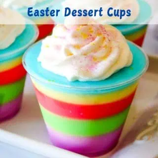Colorful layered dessert cups with whipped cream on top, labeled "Easter Dessert Cups.