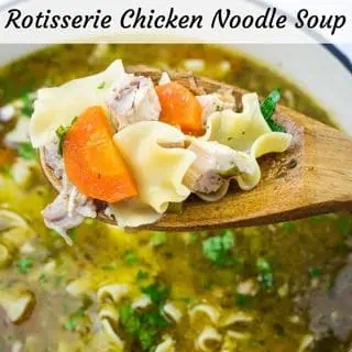 Spoonful of rotisserie chicken noodle soup with carrots, noodles, and herbs. Bowl in the background. Text at the top reads: "Rotisserie Chicken Noodle Soup.