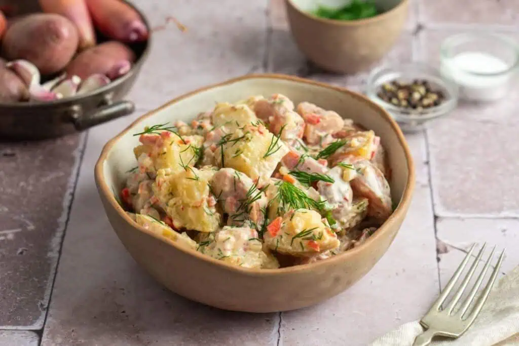 Delicious Creamy Red Potato Salad with Pickle in a bowl.