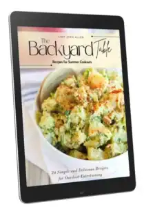 An e-book titled "The Backyard Table: Recipes for Summer Cookouts" by Chef Jenn Allen is displayed on a tablet, featuring a bowl of potato salad on the cover.