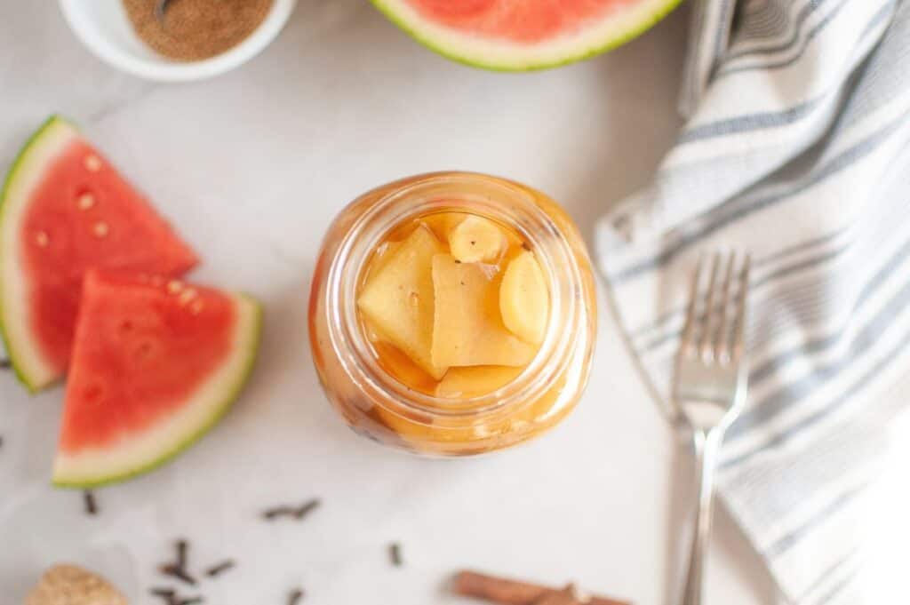 Watermelon and apple jam in a jar.