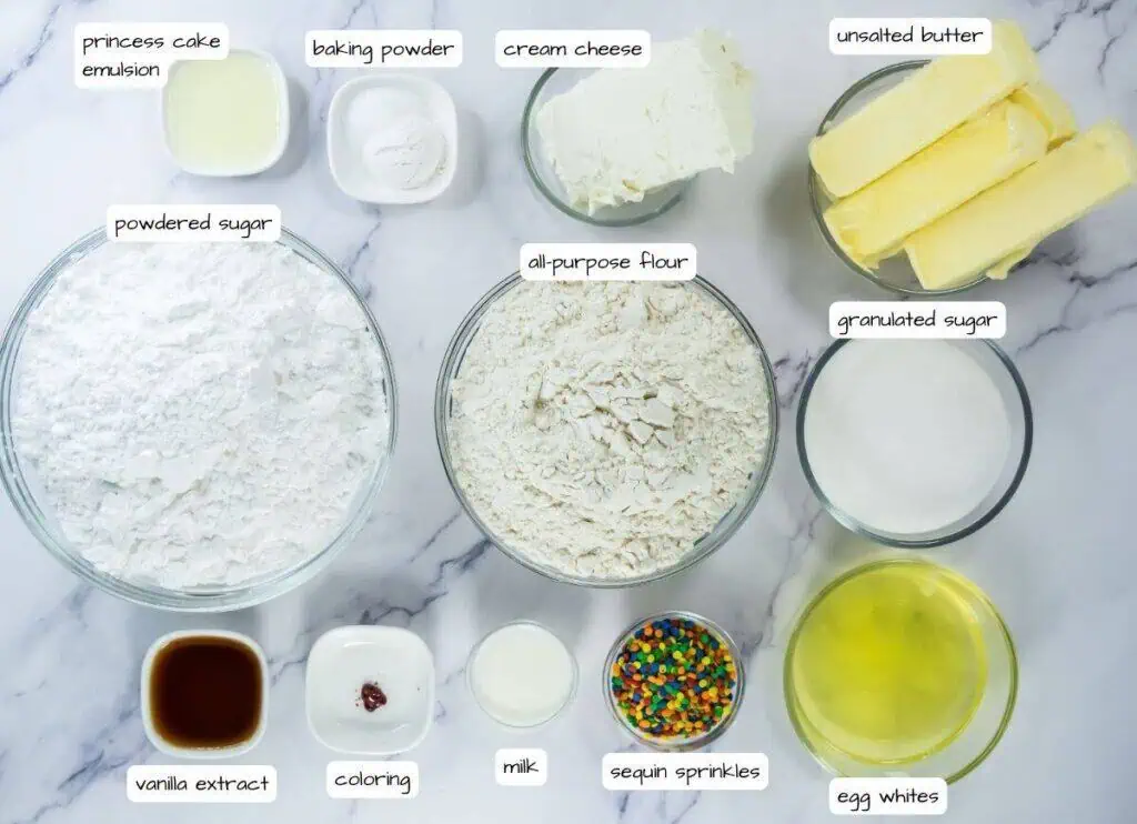 Ingredients for a cake on a marble counter.