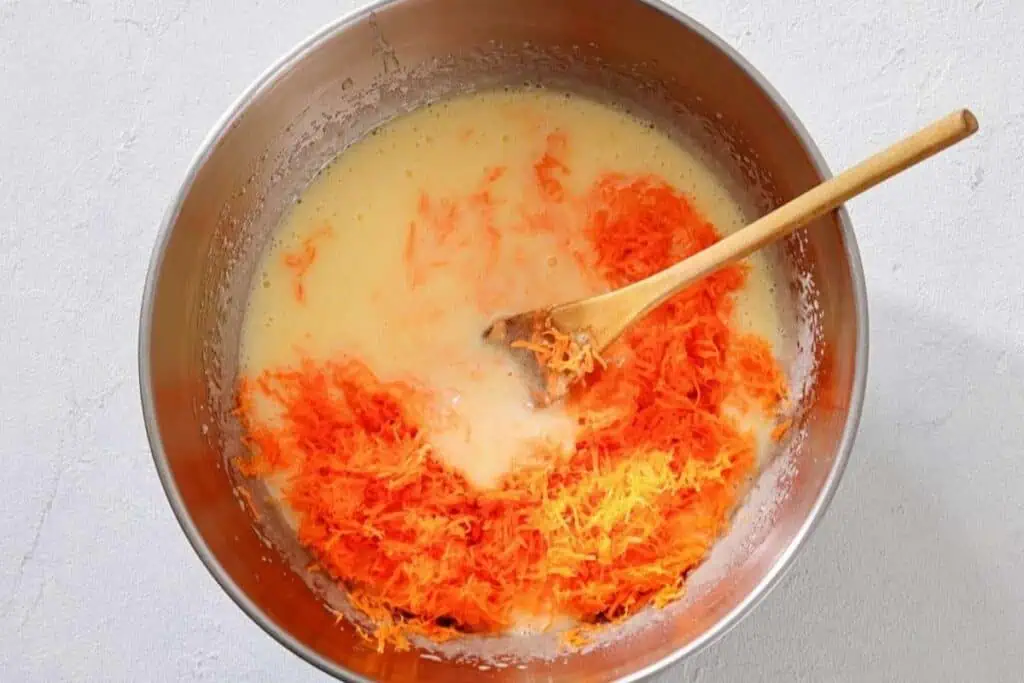 A bowl of food with a wooden spoon.