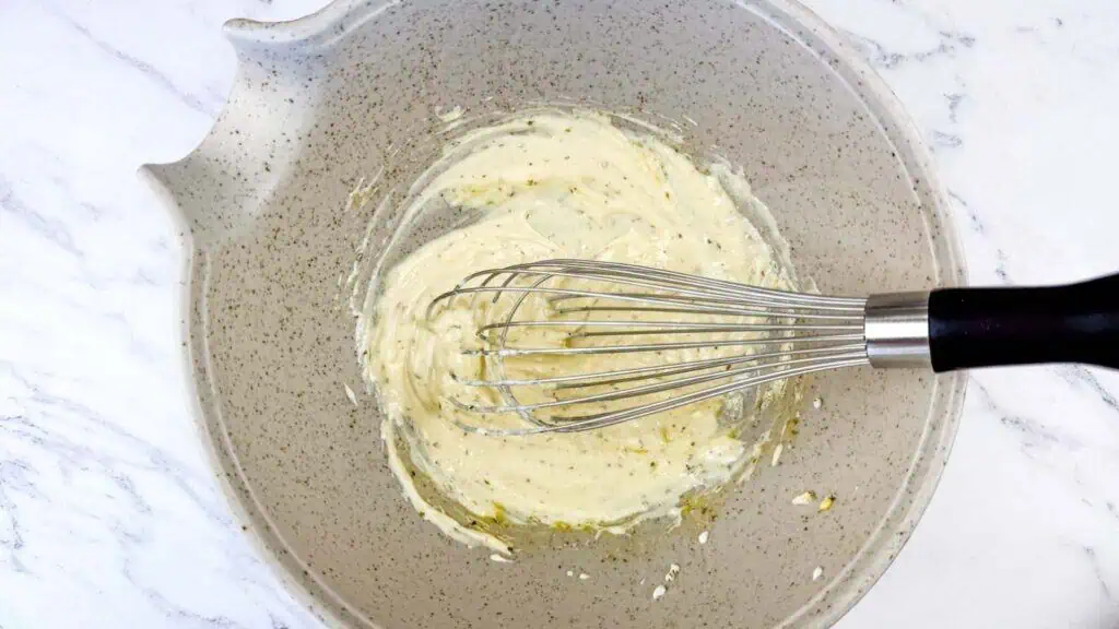 Greek yogurt, olive oil, lemon juice, red wine vinegar, Dijon mustard, garlic, oregano, salt, and pepper whisked in a medium bowl.
