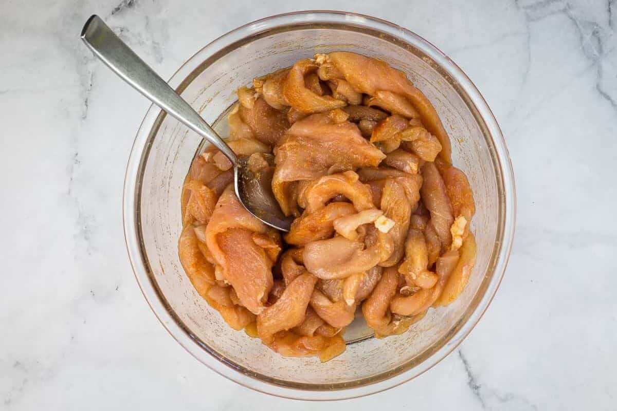 Chicken mixed with the spices.