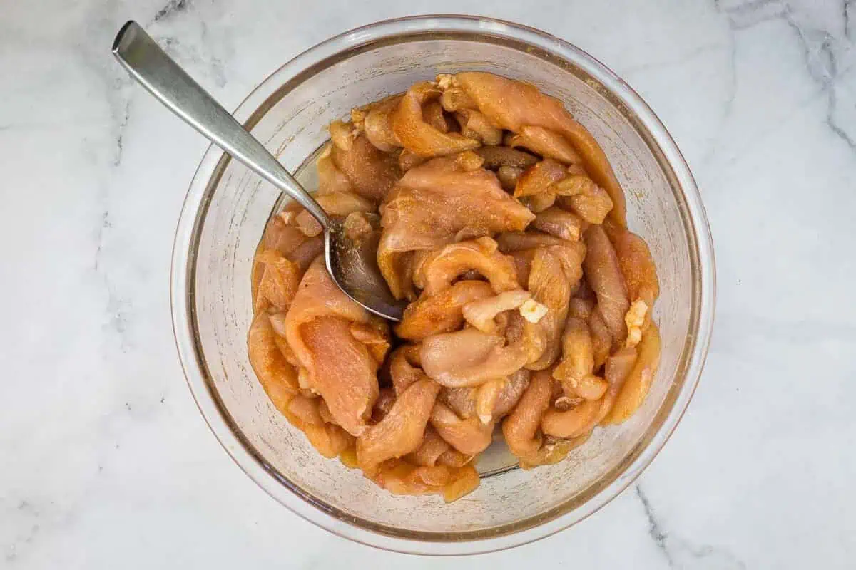 Chicken mixed with the spices.