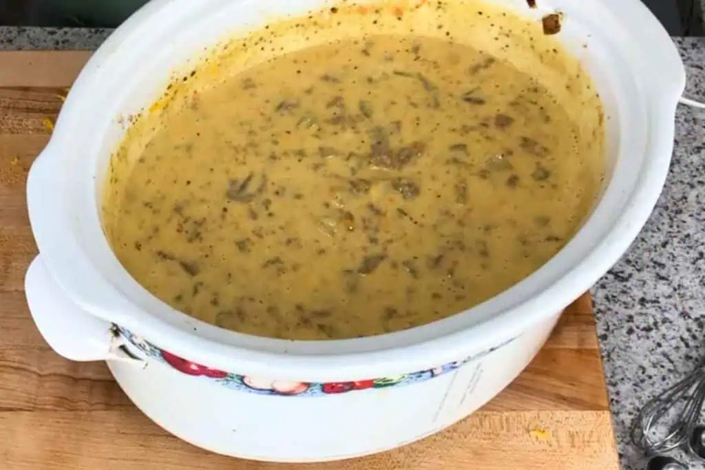 Creamy soup with meat and vegetables in a slow cooker.